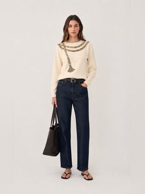 Vintage cream colored angora and lambs wool sweater with beaded detail. Medium